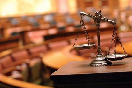 scales_of_justice_against_blurred_court_room_cu