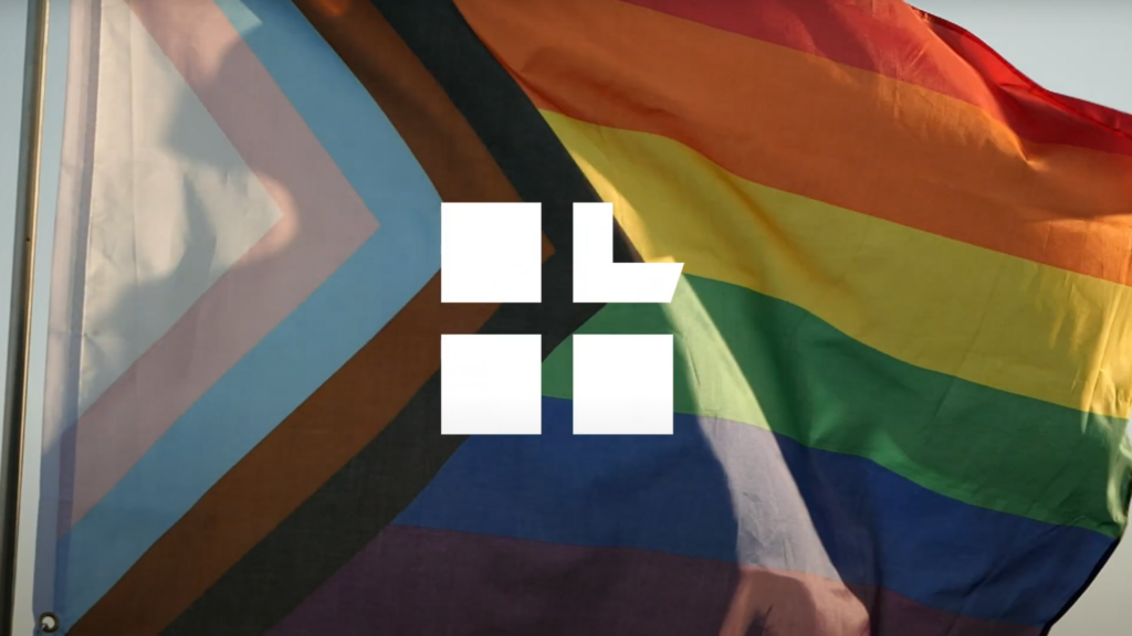 Equality pride flag with Lambda Legal logo overlaid on top