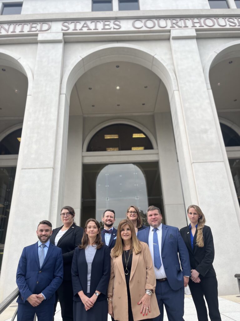Lawyers from Lambda Legal, Southern Legal Counsel, Florida Health Justice Project, and National Health Law Program, and Pillsbury Winthrop Shaw Pittman LLP outside of the United States Federal Courthouse for the Northern District of Florida.