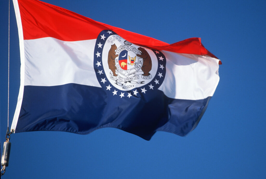 Missouri state flag flies in the wind.