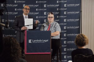Lambda Legal lawyer Paul Castillo stands with client Dana Zzyym.