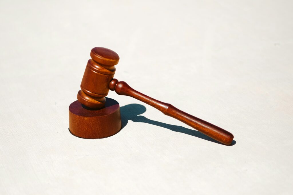 brown wooden gavel on white marble table