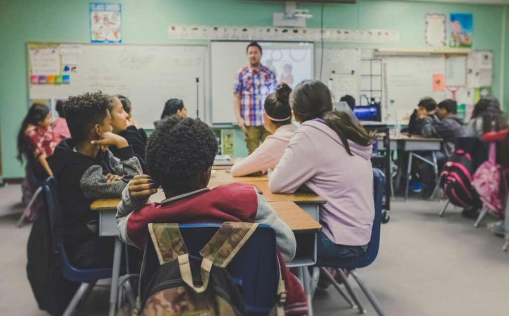 teacher and students in a classroom back-to-school