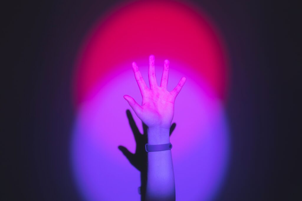 bisexual flag colors with a hand reaching out