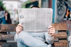 someone reading a newspaper