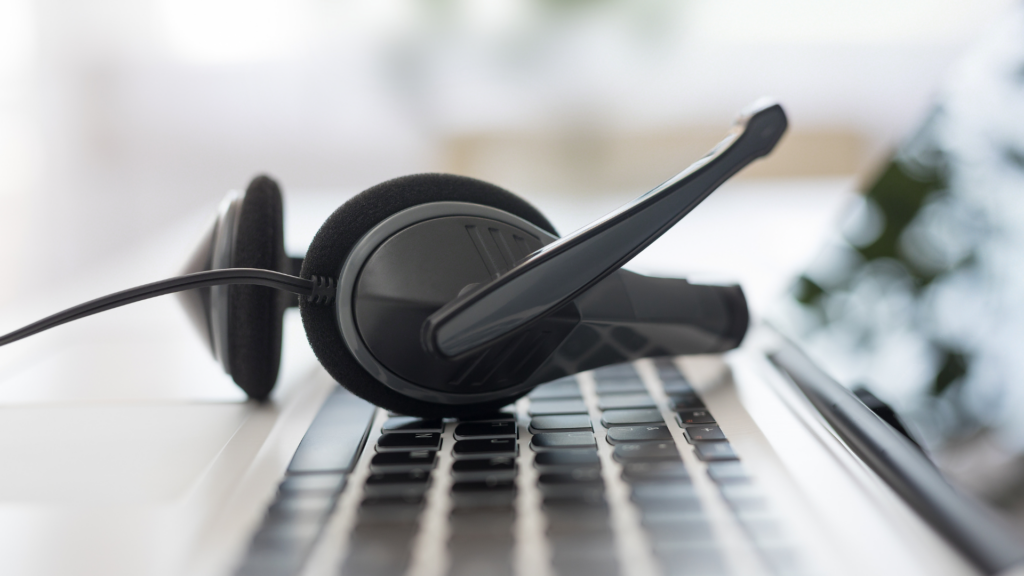 headset resting on a computer keyboard
