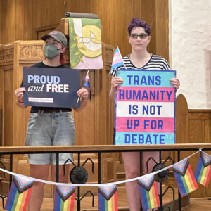 People holding signs at D.C. Proud and Free rally