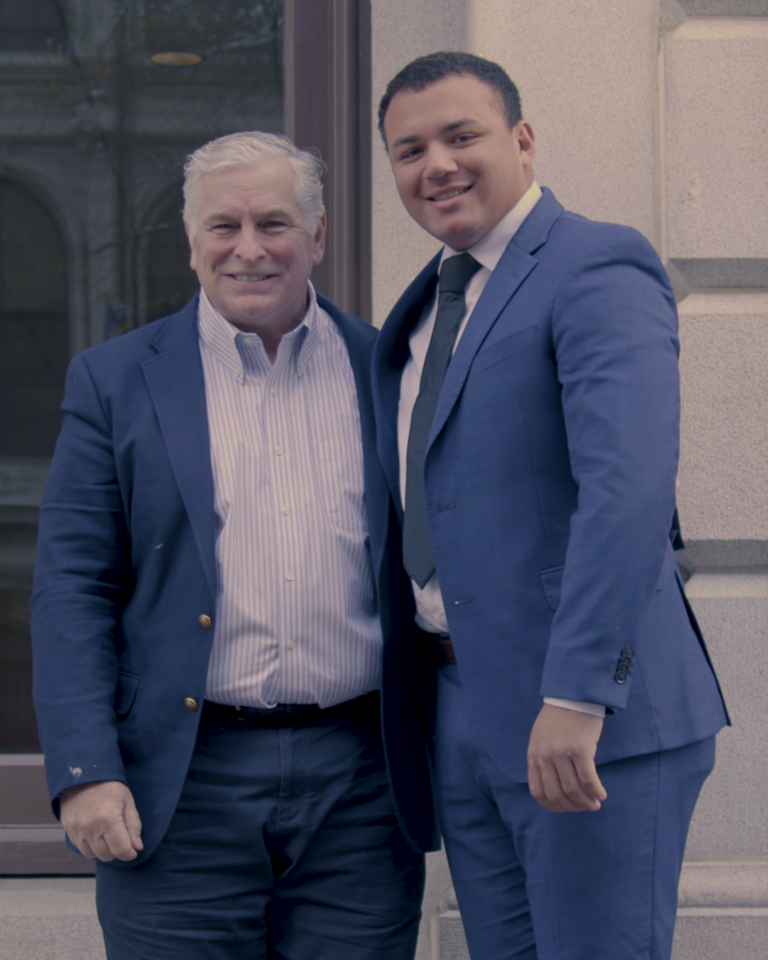 Lambda Legal CEO Kevin Jennings and plaintiff Isaiah Wilkins.