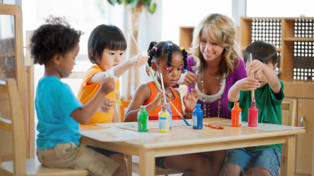 young children in a preschool classroom with a teacher